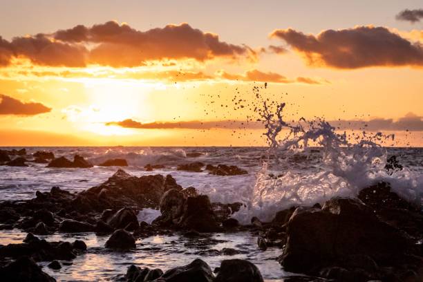istock Stunning seascape featuring a dramatic sky filled with oranges and pinks at sunset 1569305395