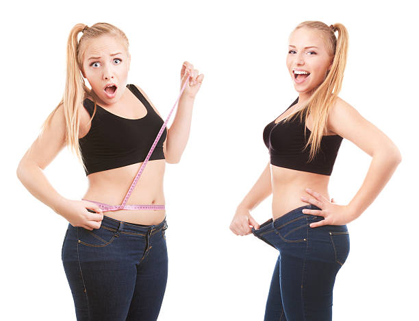 Before and after a diet girl surprised by measuring waist before and after weight loss stock pictures, royalty-free photos & images