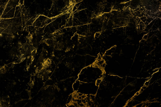 istock Black marble with golden curly veins pattern background for design 1569317927