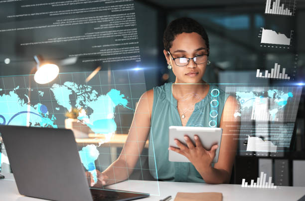 istock Black woman with tablet, laptop and data overlay for erp innovation, research and programming in future technology. Futuristic global analytics, it software and developer for startup business website 1569325955