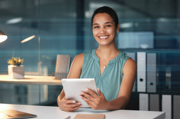 istock Office tablet, night portrait and black woman editing social network article, digital website or online web blog. Happy research employee, media business and journalist working overtime on news post 1569348738