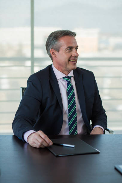 istock Senior manager portrait in office 1569359359