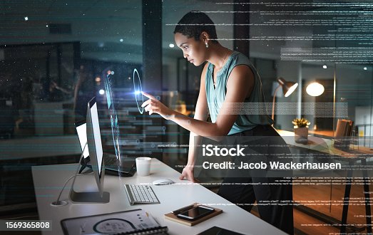 istock Office computer, hologram and woman point at future administration ui, research analytics or dashboard. Digital transformation software, night overlay profile and African person work on data analysis 1569365808