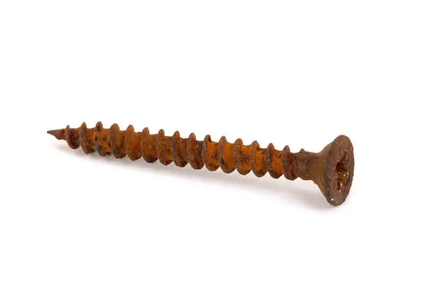 Photo of Rusty old screw isolated on white background