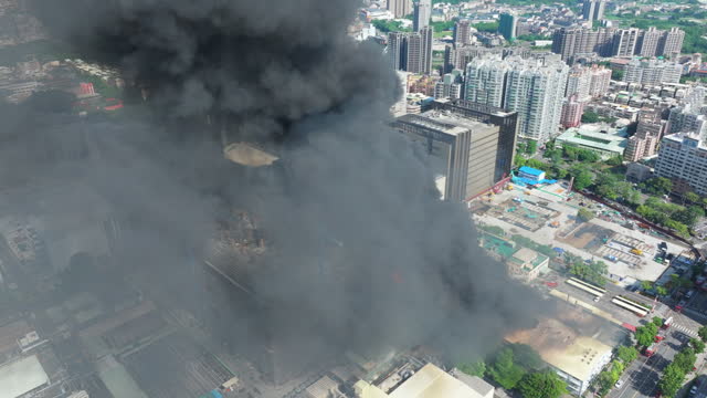 Aerial view of Fire in industrial building at city