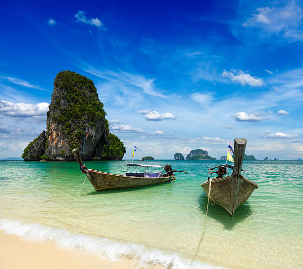 istock Long tail boats on beach, Thailand 156938622