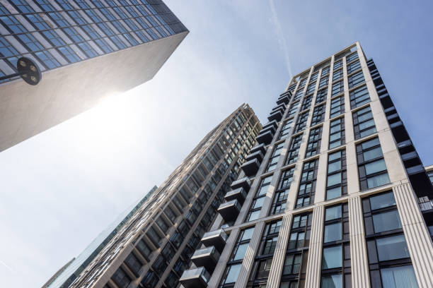 istock Modern buildings in London viewed from below with sunlight. 1569403817