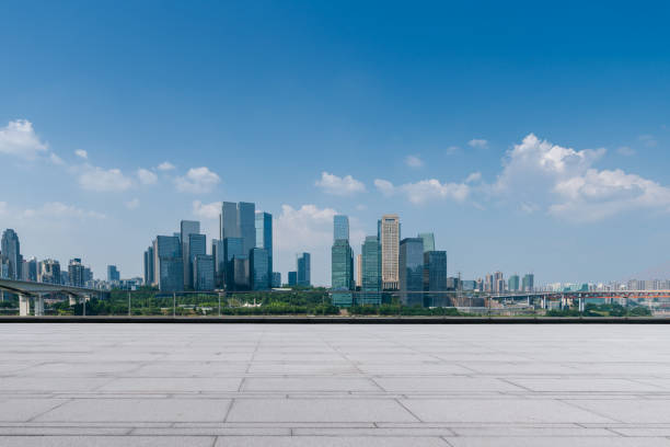 istock empty ground floor with modern cityscape and office buildings. 1569404916