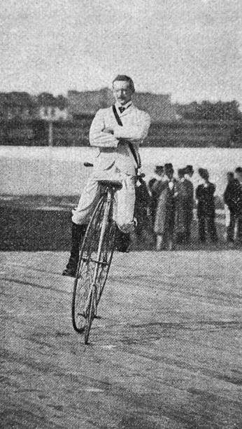 istock Centenar Sportfest in Berlin, Penny farthing bicycle competition winner during the round of honour in the velodrome 1569406027