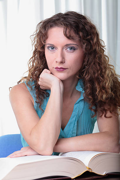 istock Young woman with book. 156941406