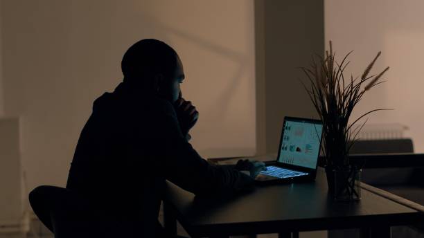 istock Freelancer working overnight at home 1569428300