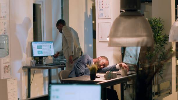 istock Employee catching coworker asleep 1569428822