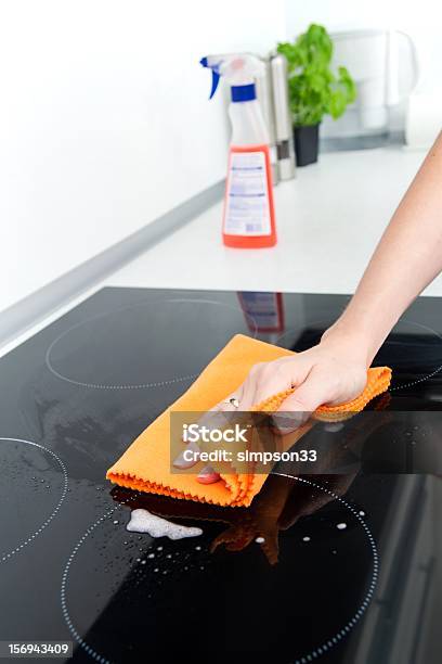 Hand Cleaning Induction Stove Stock Photo - Download Image Now - Cleaner, Cleaning, Dishwashing Liquid