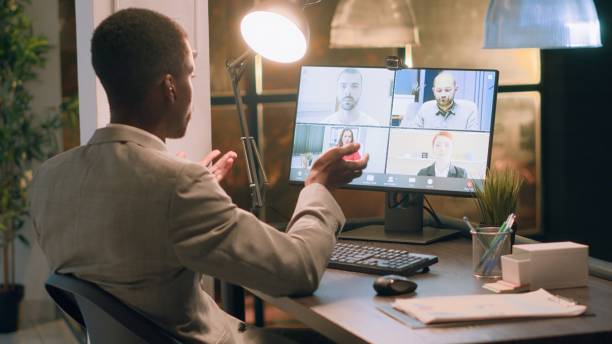 istock Teleworking employee in online videocall 1569446670