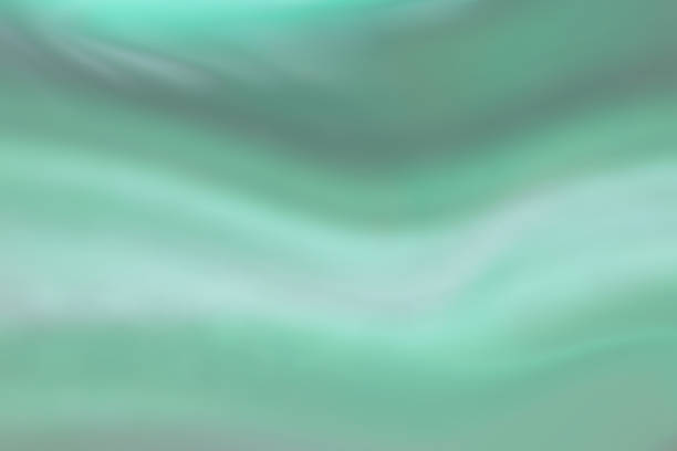 istock Soft retouched abstract background in turquoise green color with light wavy stripes, based on Malachite power stone texture. 1569463893