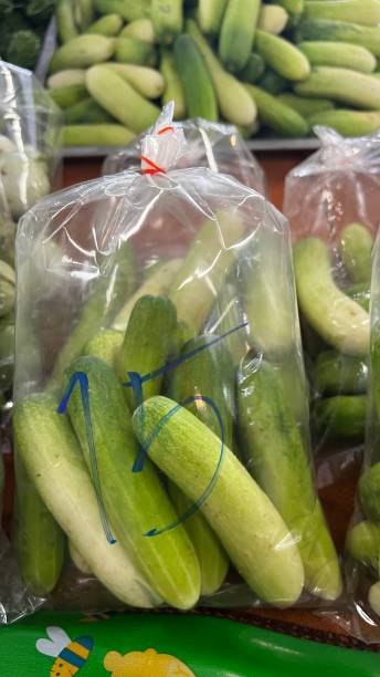 istock Fresh organic green cucumbers 1569468818