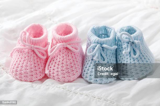 Closeup Of Pink And Blue Crocheted Baby Shoes Stock Photo - Download Image Now - Baby Booties, Blue, Pink Color