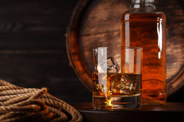 istock Glass and bottle with cognac 1569499520
