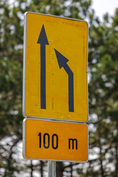 istock Merge Traffic Road Sign 1569504956