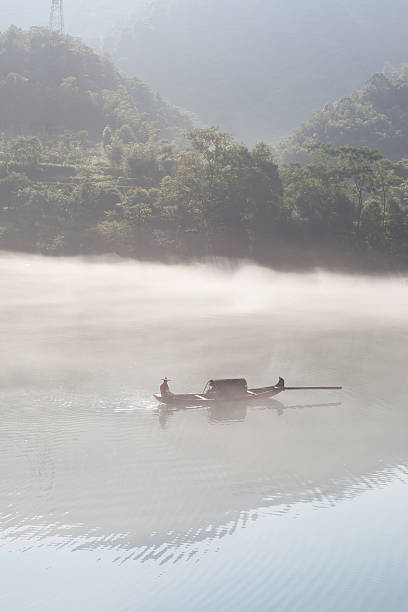 istock fishermen in the fog preparing to fish 156952253