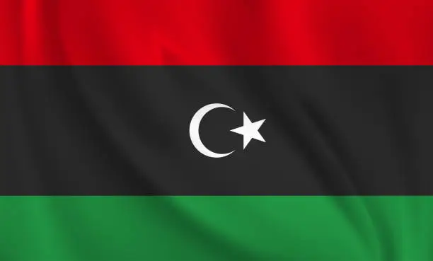 Vector illustration of Waving flag of Libya blowing in the wind. Full page flying flag