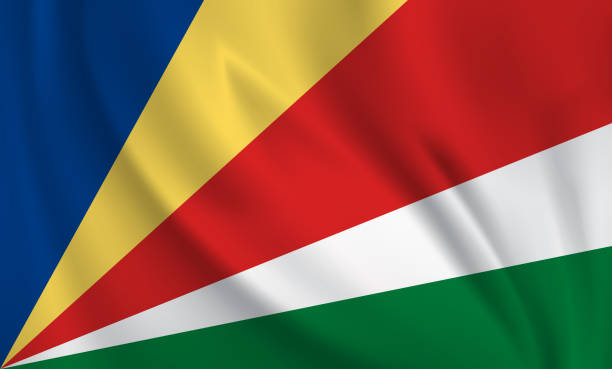 istock Waving flag of Seychelles blowing in the wind. Full page flying flag 1569539944