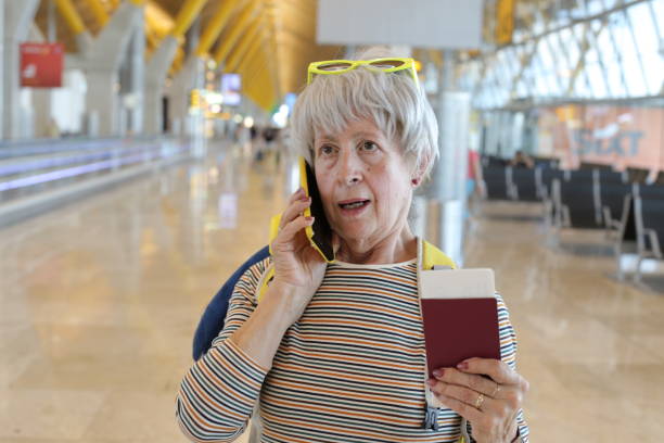 istock Senior traveler getting upsetting news 1569549653