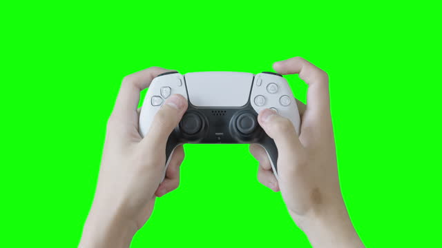 Man playing video game holding game controller in his hand.