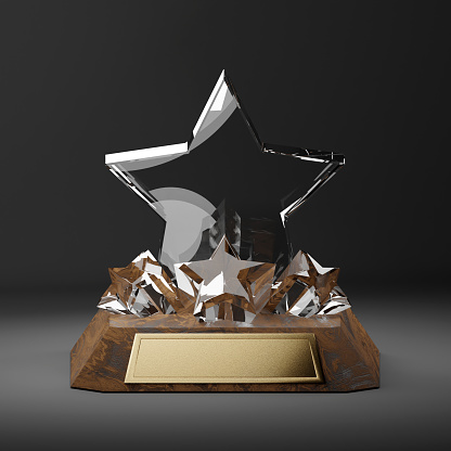 Star trophy made of crystal on wood base front view
