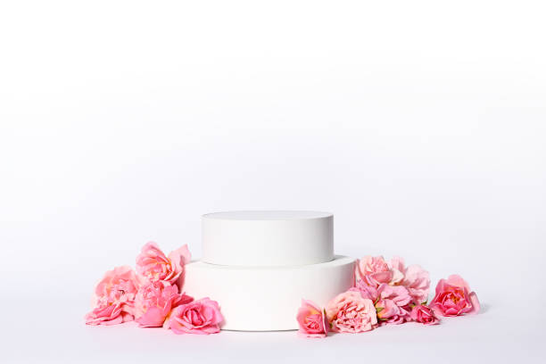 istock Template with white podium and pink roses 1569602580