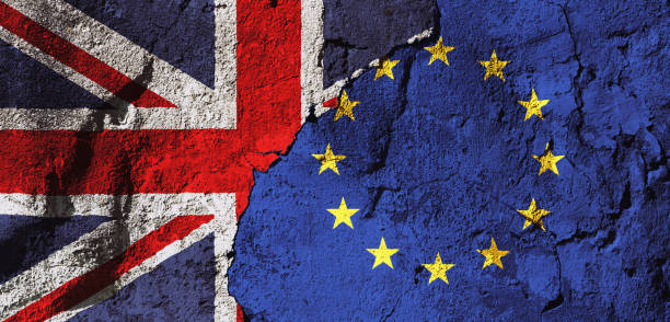 British and European Union flags interlocking on a rough, textured plaster wall