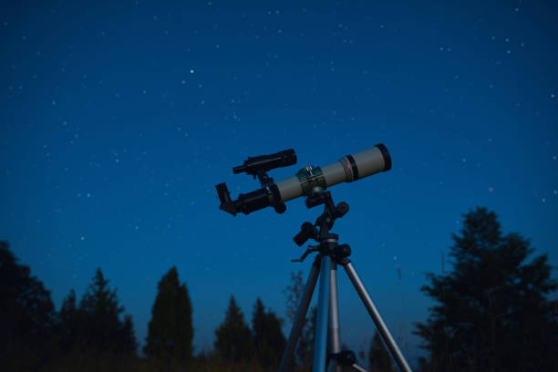 istock Astronomical telescope for observing stars, planets, Moon, celestial objects in the sky. 1569618069