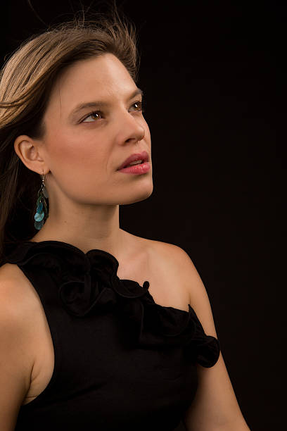 istock Beautiful  Young Woman on Black 156964089