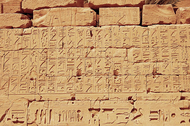 istock Old egypt hieroglyphs from Karnak temple in Luxor 156964608