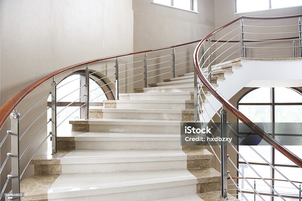 marble stairs A marble, spiral staircase in the fashionable hotel. Staircase Stock Photo