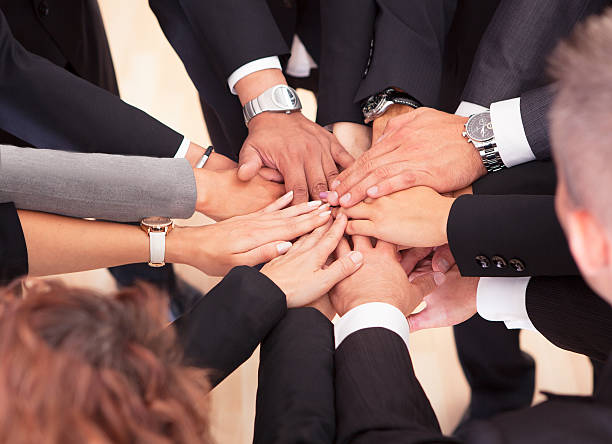 istock Business People With Their Hands Together 156970437