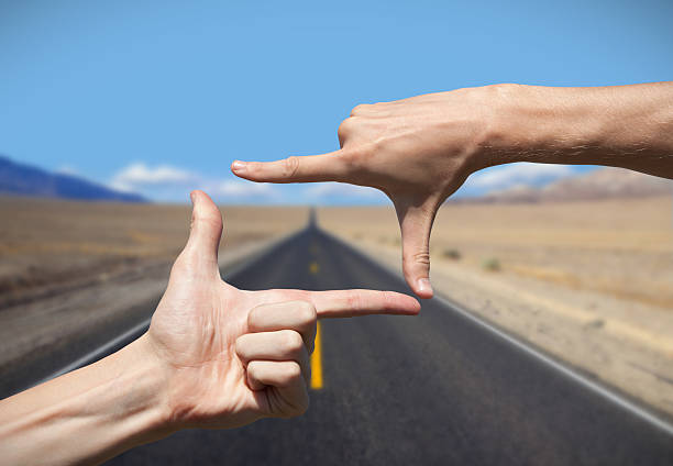 Composition frame Composition frame with road on background hand cropping photos stock pictures, royalty-free photos & images