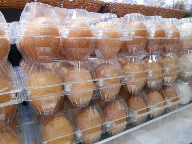 istock Plastic packs of eggs in supermarket 1569719386