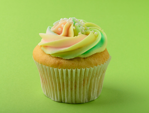 Cupcake on green background