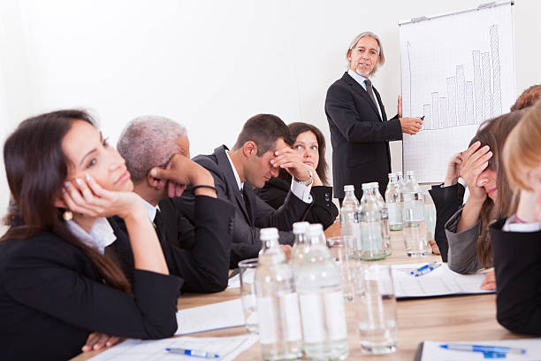 Portray of a group of disappointed business colleagues Photo Of Sad Business Team Attending The Seminar boredom stock pictures, royalty-free photos & images