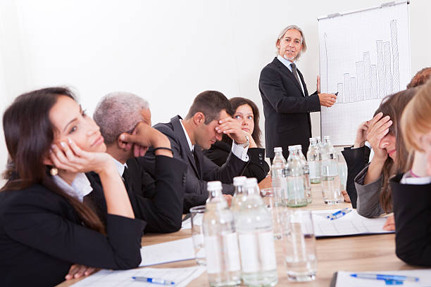 portray of a group of disappointed business colleagues - 無聊 個照片及圖片檔