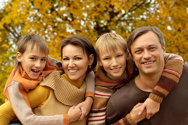 istock nice family relaxing in autumn 156974502