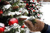 A Christmas tree on the street decorated with Christmas toys, deer.Decoration for New Year and Christmas