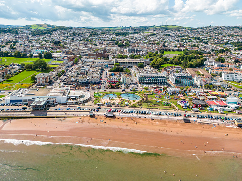 Paignton Seafront with funfair and beach in Devon