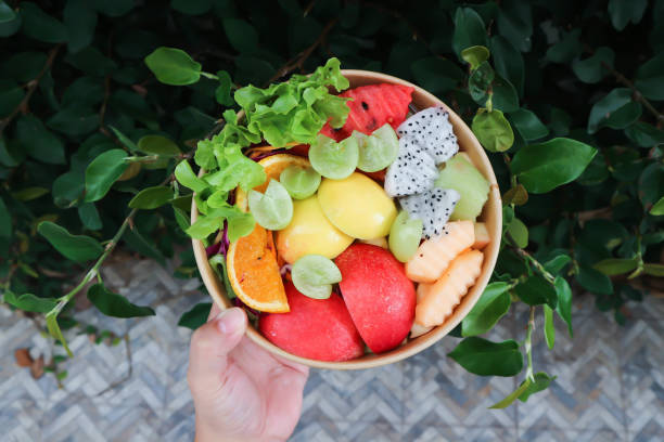 istock fruit and vegetable salad or apple, dragon fruit and lettuce salad 1569774372