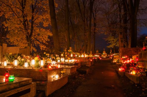 Сemetery with candles on the graves. Poland, Krakow.