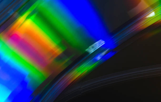 istock Colorful rainbow light pattern over dark wall, abstract photo 1569836425