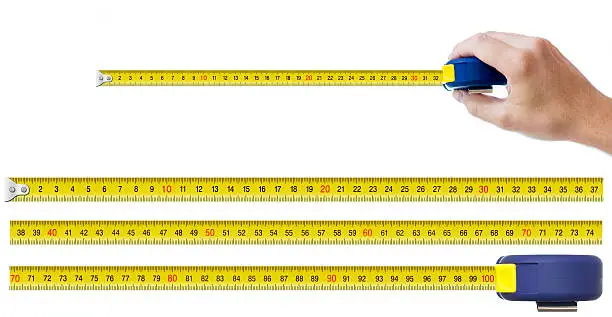 human hand with tape-measure and set of pieces allowing to make any size of tape up to one meter