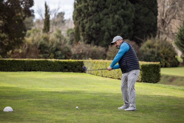 istock Adult man playing golf in autumn 1569852775