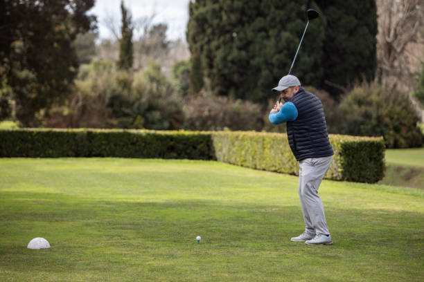 istock Adult man playing golf in autumn 1569852823